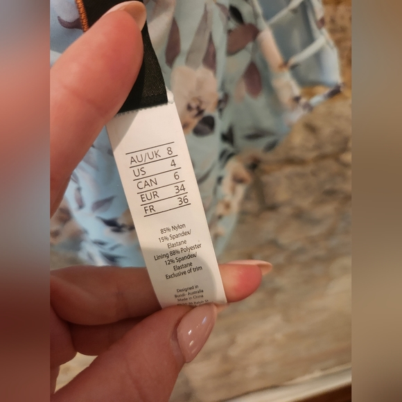 One piece swimsuit. Baby blue, floral print. Crisscross back and side cut outs - Picture 5 of 5